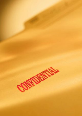 File folder stamped with Confidential
