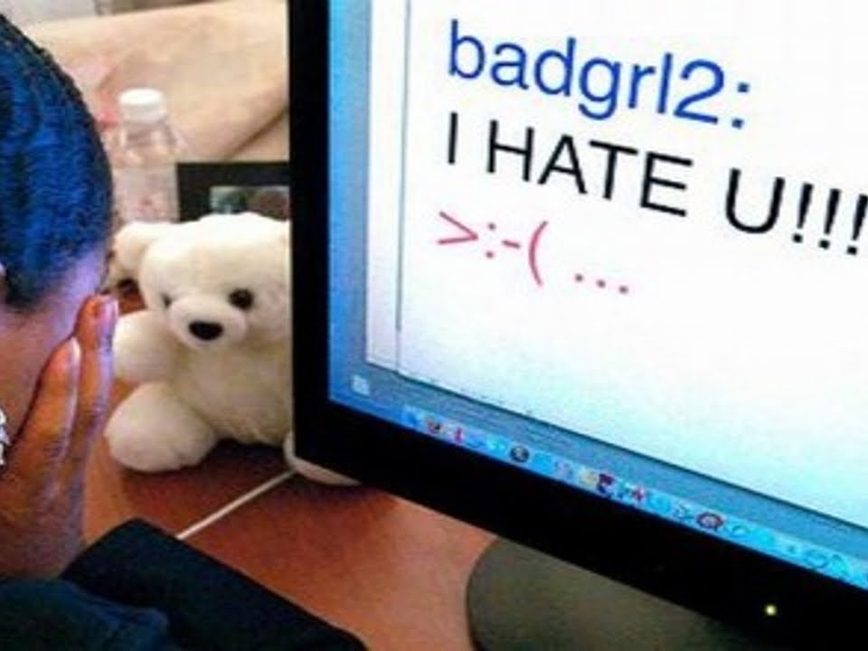 Computer with a bullying message and the user is crying.